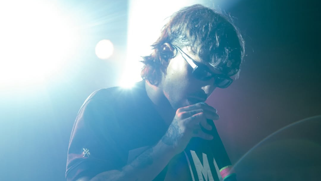 Ketama126 wearing the WALMUG x Ketama Capsule while performing